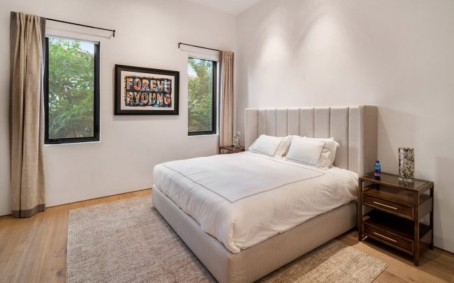 Modern bedroom in an exclusive waterfront luxury villa rental in Miami - Nomade Villa Collection