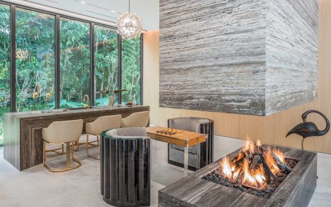 Working modern fireplace in an exclusive waterfront luxury villa rental in Miami - Nomade Villa Collection